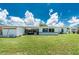 Large backyard with a shed, patio area, and ample green space at 720 Dalton Blvd, Port Charlotte, FL 33952