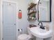 Bathroom featuring new tile, black fixtures, and open shelving for ample storage space at 720 Dalton Blvd, Port Charlotte, FL 33952