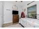Bedroom with lots of natural light, nautical themed decor, a flat screen TV and wood-look floors at 720 Dalton Blvd, Port Charlotte, FL 33952