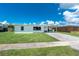 Delightful home with a covered carport and manicured lawn, offering a blend of comfort and convenience at 720 Dalton Blvd, Port Charlotte, FL 33952