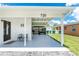 Inviting front porch with seating and covered parking, enhancing the home's functionality and appeal at 720 Dalton Blvd, Port Charlotte, FL 33952