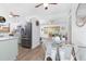 Kitchen view overlooking dining area, showcasing the stainless steel appliances and the open layout at 720 Dalton Blvd, Port Charlotte, FL 33952