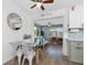 View of the kitchen through the dining area, highlighting stainless appliances and bright living space at 720 Dalton Blvd, Port Charlotte, FL 33952