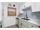 Well-equipped kitchen featuring sleek stainless steel appliances, white countertops and neutral backsplash at 720 Dalton Blvd, Port Charlotte, FL 33952