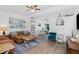 Bright living room featuring beachy decor, wood floors, and comfortable seating, creating an inviting space at 720 Dalton Blvd, Port Charlotte, FL 33952