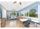 Bright living space featuring tile flooring, stylish seating, desk area, and large sunny windows at 720 Dalton Blvd, Port Charlotte, FL 33952