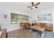 Comfortable living room with wood-look floors, ample natural light, and stylish decor, creating a relaxing ambiance at 720 Dalton Blvd, Port Charlotte, FL 33952