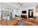 Inviting living space showcasing modern flooring, a large TV, and comfortable seating, ideal for relaxation and entertainment at 720 Dalton Blvd, Port Charlotte, FL 33952