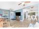 Open living space featuring tile flooring, stylish seating, a tv, and seamless access to the kitchen at 720 Dalton Blvd, Port Charlotte, FL 33952