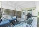 Cozy outdoor patio with stylish furniture, a privacy screen, and grilling station at 720 Dalton Blvd, Port Charlotte, FL 33952