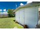 Exterior shot of a well-maintained shed in a grassy backyard at 720 Dalton Blvd, Port Charlotte, FL 33952
