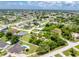 Expansive aerial view of a residential neighborhood featuring well-maintained homes and lush green landscaping at 976 Great Falls Nw Ter, Port Charlotte, FL 33948