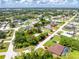 Expansive aerial view of the property highlighting its location within a quiet residential neighborhood at 976 Great Falls Nw Ter, Port Charlotte, FL 33948