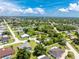Aerial view showcases the home's location, with lush surroundings, offering a serene setting at 976 Great Falls Nw Ter, Port Charlotte, FL 33948