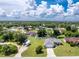 Beautiful aerial of a residential neighborhood with a lush landscape and well-maintained homes and long driveways at 976 Great Falls Nw Ter, Port Charlotte, FL 33948