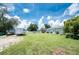 Large grassy backyard features vehicle parking, perfect for outdoor activities and relaxation at 976 Great Falls Nw Ter, Port Charlotte, FL 33948