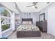 Cozy bedroom showcasing a bed with starfish accents, natural light from a nearby window and stylish decor at 976 Great Falls Nw Ter, Port Charlotte, FL 33948