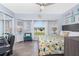 Inviting bedroom with a cozy seating area, arched window, and calming color palette, perfect for relaxation at 976 Great Falls Nw Ter, Port Charlotte, FL 33948