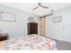 Bedroom with stylish décor, wood-look floors, barn door, and ample space, creating a warm retreat at 976 Great Falls Nw Ter, Port Charlotte, FL 33948