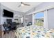 Well-lit bedroom with a mirrored closet, a desk, and an arched window offering a pleasant view at 976 Great Falls Nw Ter, Port Charlotte, FL 33948