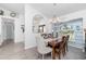 Comfortable dining area with views into the entry, living room, and a bright window at 976 Great Falls Nw Ter, Port Charlotte, FL 33948