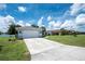 This lovely home has a two-car garage, a long driveway, and RV parking at 976 Great Falls Nw Ter, Port Charlotte, FL 33948