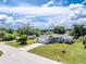Landscaped home boasts an attached two-car garage, RV parking and manicured lawn at 976 Great Falls Nw Ter, Port Charlotte, FL 33948