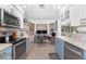 Bright kitchen featuring modern appliances and adjacent desk space at 976 Great Falls Nw Ter, Port Charlotte, FL 33948