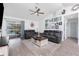 Inviting living room with comfortable leather seating and slider with view to the pool at 976 Great Falls Nw Ter, Port Charlotte, FL 33948