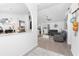 Open-concept living room with modern furniture, ceiling fan, and sliding glass doors to the pool at 976 Great Falls Nw Ter, Port Charlotte, FL 33948
