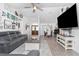Spacious living room with stylish decor, comfortable seating, and open access to dining area at 976 Great Falls Nw Ter, Port Charlotte, FL 33948