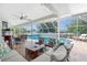Inviting outdoor area with cozy seating, a dining set, and a beautiful pool at 976 Great Falls Nw Ter, Port Charlotte, FL 33948