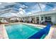 Private backyard featuring a large pool and covered patio area at 976 Great Falls Nw Ter, Port Charlotte, FL 33948