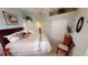 Comfortable bedroom features neutral decor, a king bed with decorative pillows, plus a full-length closet at 10214 Arrowhead Dr, Punta Gorda, FL 33955