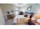 Cozy bedroom with neutral colors, a full-size bed, and lots of natural light at 10214 Arrowhead Dr, Punta Gorda, FL 33955