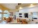 Well-lit kitchen with white cabinets, black appliances, tile backsplash, and breakfast bar at 10214 Arrowhead Dr, Punta Gorda, FL 33955