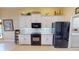 Well-equipped kitchen with modern appliances and ample cabinet space in a neutral color palette at 10214 Arrowhead Dr, Punta Gorda, FL 33955