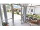 View from tiled screened porch to the homes across the street, showcasing the community at 10214 Arrowhead Dr, Punta Gorda, FL 33955