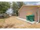 Backyard with a utility shed, fenced perimeter, and gravel ground cover alongside the home's exterior at 1053 Yarmouth St, Port Charlotte, FL 33952