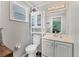 Bathroom featuring vanity, cabinet, and toilet at 1053 Yarmouth St, Port Charlotte, FL 33952