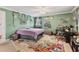 Cozy bedroom featuring natural light, green walls, and fun decorations at 1053 Yarmouth St, Port Charlotte, FL 33952
