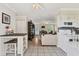 Open living space features tile flooring and transitions to the kitchen and living room at 1053 Yarmouth St, Port Charlotte, FL 33952