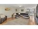 Open-concept living room featuring hardwood floors, neutral walls, and a comfortable sitting area at 1053 Yarmouth St, Port Charlotte, FL 33952