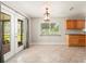 Bright dining area with doors to the backyard and views of the cabinetry at 10810 Wheeler Pl, Punta Gorda, FL 33950