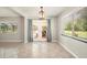Inviting dining area with tiled floors, bright windows, and sliding glass doors at 10810 Wheeler Pl, Punta Gorda, FL 33950