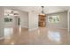 Open living area with tile flooring, ample light, and a view of the kitchen and dining area at 10810 Wheeler Pl, Punta Gorda, FL 33950