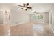 Spacious living room featuring tile floors, ceiling fans and lots of natural light at 10810 Wheeler Pl, Punta Gorda, FL 33950