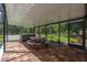 Covered patio features pavers, a hot tub, a picnic table, and a scenic view at 10810 Wheeler Pl, Punta Gorda, FL 33950