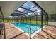 Backyard oasis showcasing a private pool with clear water and peaceful screened-in area at 10810 Wheeler Pl, Punta Gorda, FL 33950
