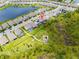 Aerial view shows the home with a playground and green space at 11105 Balfour E St, Venice, FL 34293
